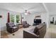Cozy living room with comfortable seating and a large-screen television, perfect for relaxing and entertaining at 610 Apple St, Gibsonville, NC 27249
