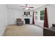 Living room with neutral walls, fireplace, natural light, and sitting area at 610 Apple St, Gibsonville, NC 27249