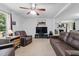 Cozy living room with comfortable seating and a large-screen television, perfect for relaxing and entertaining at 610 Apple St, Gibsonville, NC 27249