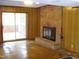 Living room with a brick fireplace and sliding glass doors leading to the outside at 6112 Yellowstone Dr, Durham, NC 27713