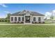 Single-story home with stone accents, a welcoming front entrance, and a spacious front yard at 63 Lynn Crest Way, Four Oaks, NC 27524