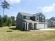 Charming two-story house with a spacious front yard and attractive landscaping at 63 Lynn Crest Way, Four Oaks, NC 27524