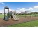 Community playground for with swings and a slide at 63 Lynn Crest Way, Four Oaks, NC 27524