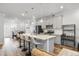 Stylish kitchen with a quartz island, modern appliances, and an open layout to the dining area at 6318 Perry Creek Rd, Raleigh, NC 27616