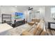Relaxing living area with a comfortable sectional sofa, ceiling fan, and entertainment center at 6318 Perry Creek Rd, Raleigh, NC 27616