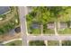Bird's eye view capturing the residential property in a suburban setting with mature trees at 702 Joyner St, Clayton, NC 27520