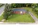 Aerial view of a single-Gathering home featuring a well-maintained lawn and landscaped surroundings at 702 Joyner St, Clayton, NC 27520