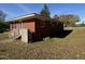 Rear view of brick house, fenced in with a gas tank at 702 Joyner St, Clayton, NC 27520