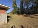 Spacious leafy backyard and partial exterior view at 702 Joyner St, Clayton, NC 27520