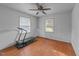 Bright bedroom with hardwood floors and two windows at 702 Joyner St, Clayton, NC 27520