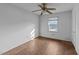 Small bedroom with a ceiling fan, window, and a simple design at 702 Joyner St, Clayton, NC 27520