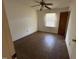 Bedroom featuring hardwood floors, a ceiling fan, and a window for natural light at 702 Joyner St, Clayton, NC 27520