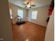 Bedroom featuring hardwood floors, two windows for natural light, and a ceiling fan at 702 Joyner St, Clayton, NC 27520