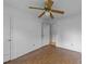 Neutral bedroom with ceiling fan, showcasing its basic, minimalist features at 702 Joyner St, Clayton, NC 27520