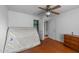 Cozy bedroom with hardwood floors, ceiling fan, and closet at 702 Joyner St, Clayton, NC 27520