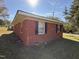 Brick home exterior with tidy lawn and classic architectural details at 702 Joyner St, Clayton, NC 27520