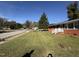 Charming red brick home with a spacious front yard and manicured lawn on a sunny day at 702 Joyner St, Clayton, NC 27520