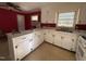 Bright kitchen with white cabinets and ample counter space, providing a functional cooking and serving area at 702 Joyner St, Clayton, NC 27520