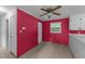 View of the kitchen area, with an adjacent space and a ceiling fan at 702 Joyner St, Clayton, NC 27520