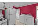 This shot shows the kitchen appliances, laundry area, door to the exterior at 702 Joyner St, Clayton, NC 27520