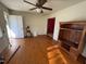 Spacious living area with hardwood floors and good natural light from the exterior door and windows at 702 Joyner St, Clayton, NC 27520