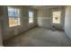 Unfinished bedroom with three windows showcasing the potential for natural light and comfortable living space at 744 Portland Rose Dr, Knightdale, NC 27545