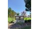 Paddington Station community sign with lush landscaping and vibrant trees creates an inviting atmosphere at 744 Portland Rose Dr, Knightdale, NC 27545