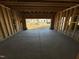 View from inside the unfinished two-car garage toward the street, highlighting the home's structure at 744 Portland Rose Dr, Knightdale, NC 27545