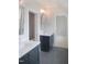 Bathroom with double vanity, gray tile flooring, and white countertops at 7723 Roberts Rd, Apex, NC 27523