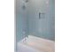 Bathroom with a bathtub and blue subway tile at 7723 Roberts Rd, Apex, NC 27523
