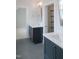 Bathroom with double vanity, gray tile flooring, and white countertops at 7723 Roberts Rd, Apex, NC 27523