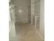 Walk-in closet featuring custom shelving, closet rods, and built-in storage solutions for organization at 7723 Roberts Rd, Apex, NC 27523