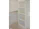 Bright walk-in closet with adjustable shelving and wood rods at 7723 Roberts Rd, Apex, NC 27523
