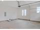 Spacious two car garage with white walls and large double windows at 7723 Roberts Rd, Apex, NC 27523