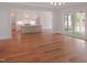 Spacious living room with seamless access to outdoor patio through sliding glass doors and an open kitchen at 7723 Roberts Rd, Apex, NC 27523