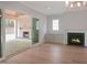 Inviting living room with two fireplaces, and sliding glass door to covered patio at 7723 Roberts Rd, Apex, NC 27523