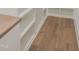 Custom built in shelving and storage area with hardwood floors and a stained countertop at 7723 Roberts Rd, Apex, NC 27523