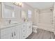 Bathroom with a double sink vanity, and bathtub/shower at 912 Obsidian Way, Durham, NC 27703