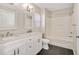 Well-lit bathroom features a double vanity with marble countertop and a shower and tub combo at 912 Obsidian Way, Durham, NC 27703