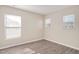 A bright, minimalist bedroom with fresh paint, updated floors and ample natural light at 912 Obsidian Way, Durham, NC 27703