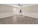 Bright living room with contemporary gray flooring and white wainscoting and trim at 912 Obsidian Way, Durham, NC 27703