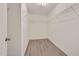 Walk-in closet with white walls and a closet organization system at 912 Obsidian Way, Durham, NC 27703