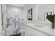 A modern bathroom boasts a shower-tub combo, sleek vanity, and contemporary fixtures for a relaxing experience at 913 Myers Point Dr, Morrisville, NC 27560
