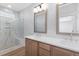 Spacious primary bathroom featuring double sinks, quartz counters, and a luxurious marble tiled shower with bench at 913 Myers Point Dr, Morrisville, NC 27560