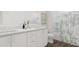 Bright bathroom featuring a double vanity with quartz counters and a shower/tub combo with decorative tile at 913 Myers Point Dr, Morrisville, NC 27560