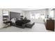 A spacious bedroom featuring a luxurious bed, stylish nightstands, and abundant natural light from large windows at 913 Myers Point Dr, Morrisville, NC 27560