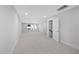 This large bonus room has carpet flooring and two large windows at 913 Myers Point Dr, Morrisville, NC 27560