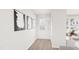 Welcoming entryway with modern light fixture, wood-look floors, and striking artwork for a stylish first impression at 913 Myers Point Dr, Morrisville, NC 27560