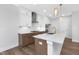 Bright, modern kitchen featuring white cabinets, stainless steel appliances, and a spacious island at 913 Myers Point Dr, Morrisville, NC 27560