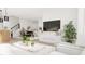 An open-concept living room flows into the dining area, with ample seating, natural light, and stylish decor at 913 Myers Point Dr, Morrisville, NC 27560